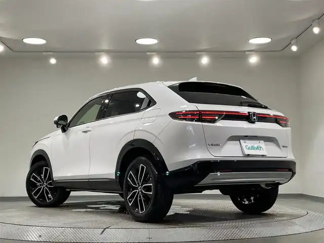 ホンダ ヴェゼル ハイブリッド e:HEV Z 愛知県 2025(令7)年 0.1千km プラチナホワイトパール 登録済未使用車/純正９インチホンダコネクトディスプレイナビ　/(Bluetooth/フルセグTV/USB/スマートフォン連携/FM/AM)/ホンダセンシング　/　　-衝突軽減ブレーキ（CMBS)/　　-誤発進抑制機能/　　-路線逸脱抑制機能/　　-アダプティブクルーズコントロール/　　-車線維持支援システム/　　-オートハイビーム/　　-先行車発進お知らせ/　　-標識認識機能/ビルトインＥＴＣ２．０　/ＬＥＤヘッドライト/LEDフォグランプ　/バックカメラ　/ワイヤレス充電　/シートヒーター/ステアリングヒーター　/電動バックドア　/ブラインドスポットモニター（ＢＳＭ）/コーナーセンサー/パドルシフト/プッシュスタート/　　-スマートキー
