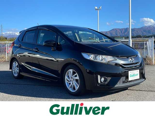 ホンダ フィット 13G Sパッケージ 富山県 2014(平26)年 7万km クリスタルブラックパール 禁煙車/社外ナビ/バックカメラ/フルセグTV/電動格納ミラー/ドライブレコーダー/CTBA/アイドリングストップ/プッシュスタート/スマートキー/ETC/純正アルミホイール/純正フロアマット/カーテンエアバッグ/横滑り防止装置