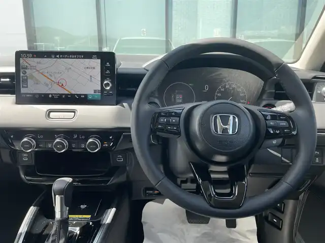 ホンダ ヴェゼル ハイブリッド e:HEV Z 香川県 2025(令7)年 0.1千km プラチナホワイトパール 登録時走行距離：3km/ホンダセンシング/純正9インチナビ/ホンダコネクトディスプレイ/ワイヤレス充電/バックカメラ/レーダークルーズコントロール/ダウンヒルアシストコントロール/前席シートヒーター/革巻きステアリング/ステアリングリモコン/レーダークルーズコントロール/ブラインドスポットモニター/オートハイビーム/LEDヘッドライト/フォグライト/ETC2.0/純正18インチアルミホイール/ハーフレザー/スマートキー/プッシュスタート/Bluetooth/電動格納ウィンカーミラー/ISOFIX