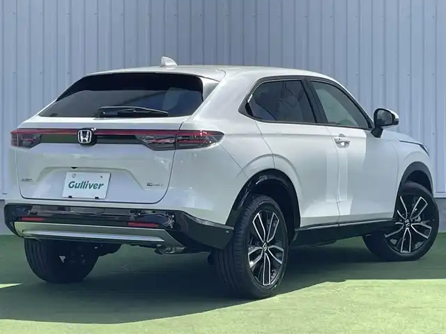 ホンダ ヴェゼル ハイブリッド e:HEV Z 香川県 2025(令7)年 0.1千km プラチナホワイトパール 登録時走行距離：3km/ホンダセンシング/純正9インチナビ/ホンダコネクトディスプレイ/ワイヤレス充電/バックカメラ/レーダークルーズコントロール/ダウンヒルアシストコントロール/前席シートヒーター/革巻きステアリング/ステアリングリモコン/レーダークルーズコントロール/ブラインドスポットモニター/オートハイビーム/LEDヘッドライト/フォグライト/ETC2.0/純正18インチアルミホイール/ハーフレザー/スマートキー/プッシュスタート/Bluetooth/電動格納ウィンカーミラー/ISOFIX
