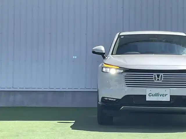 ホンダ ヴェゼル ハイブリッド e:HEV Z 香川県 2025(令7)年 0.1千km プラチナホワイトパール 登録時走行距離：3km/ホンダセンシング/純正9インチナビ/ホンダコネクトディスプレイ/ワイヤレス充電/バックカメラ/レーダークルーズコントロール/ダウンヒルアシストコントロール/前席シートヒーター/革巻きステアリング/ステアリングリモコン/レーダークルーズコントロール/ブラインドスポットモニター/オートハイビーム/LEDヘッドライト/フォグライト/ETC2.0/純正18インチアルミホイール/ハーフレザー/スマートキー/プッシュスタート/Bluetooth/電動格納ウィンカーミラー/ISOFIX