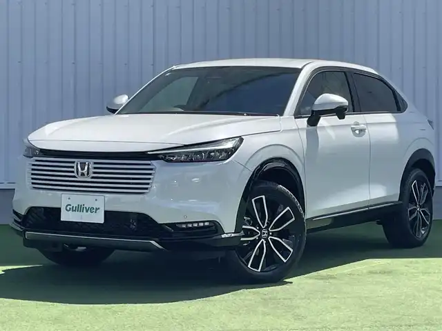 ホンダ ヴェゼル ハイブリッド e:HEV Z 香川県 2025(令7)年 0.1千km プラチナホワイトパール 登録時走行距離：3km/ホンダセンシング/純正9インチナビ/ホンダコネクトディスプレイ/ワイヤレス充電/バックカメラ/レーダークルーズコントロール/ダウンヒルアシストコントロール/前席シートヒーター/革巻きステアリング/ステアリングリモコン/レーダークルーズコントロール/ブラインドスポットモニター/オートハイビーム/LEDヘッドライト/フォグライト/ETC2.0/純正18インチアルミホイール/ハーフレザー/スマートキー/プッシュスタート/Bluetooth/電動格納ウィンカーミラー/ISOFIX