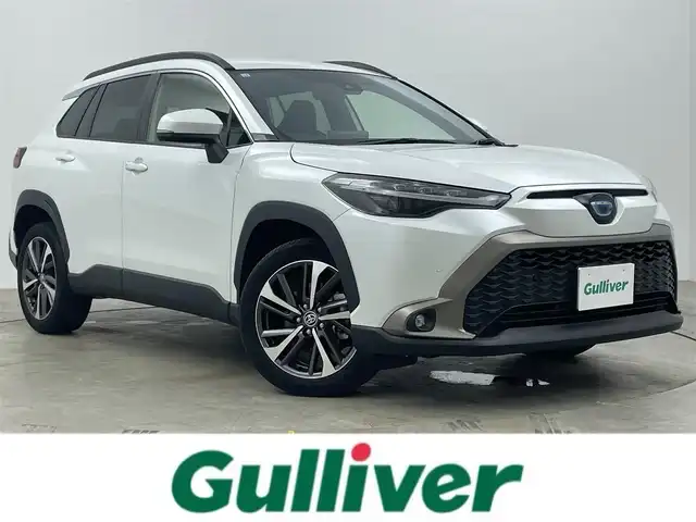 トヨタ カローラ クロス ハイブリッド Z 岡山県 2021(令3)年 2.4万km プラチナホワイトパールマイカ 純正9型ナビ/・FM/AM/Bluetooth/フルセグ/バックカメラ/半革シート/・パワーシート/・シートヒーター/パワーバックドア/トヨタセーフティーセンス/・プリクラッシュセーフティ/・レーントレーシングアシスト/・レーダークルーズコントロール/・オートマチックハイビーム/・コーナーセンサー/ETC/USB入力端子/LEDヘッドライト/純正18インチホイール/純正フロアマット/ルーフレール