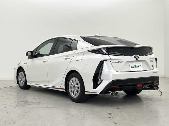 トヨタ プリウス ＰＨＶ S GRスポーツ 宮城県 2019(平31)年 7.5万km ホワイトパールクリスタルシャイン Toyota Safety Sense /・プリクラッシュセーフティ/・レーンディパーチャーアラート/・オートマチックハイビーム/・レーダークルーズコントロール/純正9インチナビ/・BT.CD.DVD.SD.USB.HDMI/・フルセグTV/バックカメラ/ハーフレザーシート/・前席シートヒーター/ビルトインETC2.0/ドライブレコーダー（FR）/LEDヘッドライト/LEDフォグライト/プッシュスタート/スマートキー×2/ステアリングスイッチ/純正フロアマット/純正15インチAW/ガナドール製マフラー/トノカバー/ウーハー/ツイーター