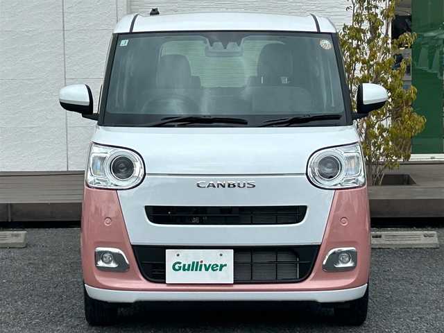 ダイハツ ムーヴ キャンバス ストライプス G 千葉県 2025(令7)年 0.1万km シャイニングホワイトパール/アプリコットピンクメタリック ディスプレイオーディオ/バックカメラ/置くだけ充電/スマートアシスト/〇衝突回避支援ブレーキ機能／衝突警報機能/〇ブレーキ制御付き誤発進抑制機能（前方・後方）/〇車線逸脱抑制制御機能／車線逸脱警報機能/〇路側逸脱警報機能／ふらつき警報/〇オートハイビーム/〇標識認識機能/コーナーセンサー/両側パワースライドドア/F席シートヒーター/アイドリングストップ/電子パーキングブレーキ/オートブレーキホールド機能