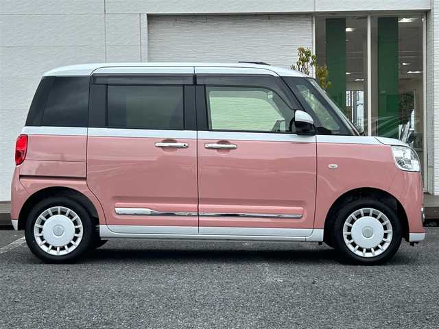 ダイハツ ムーヴ キャンバス ストライプス G 千葉県 2025(令7)年 0.1万km シャイニングホワイトパール/アプリコットピンクメタリック ディスプレイオーディオ/バックカメラ/置くだけ充電/スマートアシスト/〇衝突回避支援ブレーキ機能／衝突警報機能/〇ブレーキ制御付き誤発進抑制機能（前方・後方）/〇車線逸脱抑制制御機能／車線逸脱警報機能/〇路側逸脱警報機能／ふらつき警報/〇オートハイビーム/〇標識認識機能/コーナーセンサー/両側パワースライドドア/F席シートヒーター/アイドリングストップ/電子パーキングブレーキ/オートブレーキホールド機能