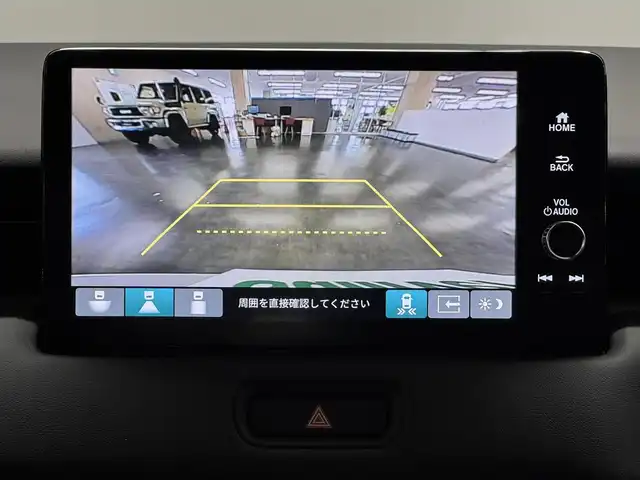 ホンダ ヴェゼル ハイブリッド e:HEV Z 三重県 2025(令7)年 0.1千km プラチナホワイトパール ハイブリッド/FF/MTモード付フロアCVT/純正 9インチナビ/（FM/AM/USB/Bluetooth/CarPlay/AndroidAuto/TV）/バックカメラ/ビルトイン ETC2.0/Honda SENSING/・衝突軽減ブレーキ（CMBS）/・先行車発進お知らせ機能/・路外逸脱抑制機能/・標識認識機能/・渋滞追従機能付アダプティブクルーズコントロール（ACC）/・車線維持支援システム（LKAS）/・トラフィックジャムアシスト（渋滞運転支援機能）/・ブラインドスポットインフォメーション/・誤発進抑制機能/・後方誤発進抑制機能/・近距離衝突軽減ブレーキ/・パーキングセンサーシステム/・【OP】後退出庫サポート/・アダプティブドライビングビーム/装備/・ハンズフリーアクセスパワーテールゲート（電動バックドア）/・ハーフレザーシート/・シートヒーター（D/N）/・ステアリングヒーター/・オートライトシステム/・LEDヘッドライト/・LEDフロントフォグランプ/・ヒルディセントコントロール/・左右独立オートエアコン/・自動防眩ルームミラー/・【OP】ワイヤレス充電器/・プッシュスタート/・純正18inAW/・保/取/・スマートキーx2
