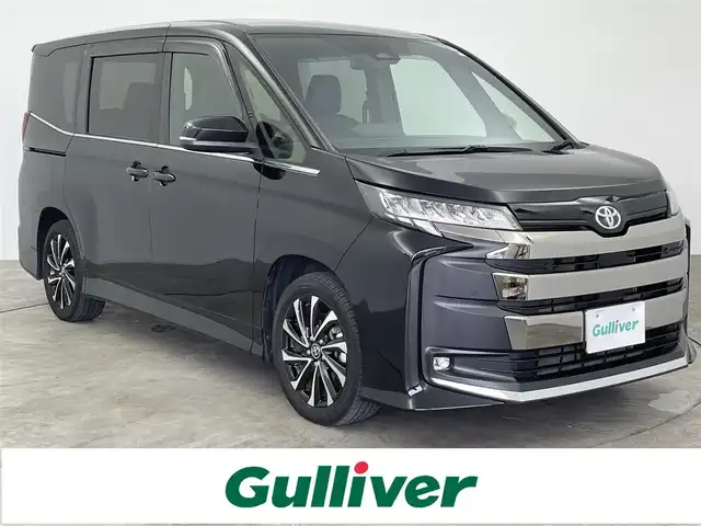 トヨタ ノア S－Z 大分県 2023(令5)年 2.3万km アティチュードブラックマイカ 純正ナビ/後席モニター/ユニバーサルステップ/バックカメラ/両側パワースライドドア/ＥＴＣ2.0/衝突軽減システム/レーンキープアシスト/クルーズコントロール/オートマチックハイビーム/シートヒーター/LEDヘッドライト/フォグランプ/革巻きステアリング/ステアリングスイッチ/純正フロアマット/ドアバイザー/スマートキー/プッシュスタート