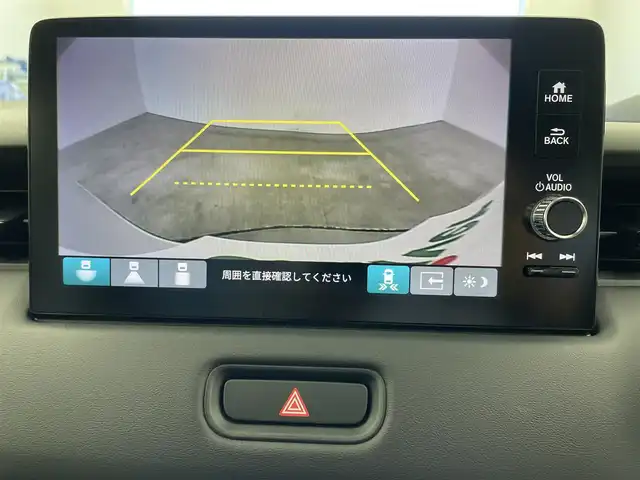 ホンダ ヴェゼル ハイブリッド e:HEV Z 愛知県 2025(令7)年 0.1千km プラチナホワイトパール 登録済み未使用車/ワイヤレス充電/純正9インチナビ/Apple CarPlay/Android Auto/Bluetooth/バックカメラ　/フルセグTV/ホンダセンシング/衝突被害軽減システム/クルーズコントロール/横滑り防止装置/コーナーセンサー/レーンキープアシスト/ブラインドスポットモニター/オートライト/オートマチックハイビーム/LEDヘッドライト/LEDフォグランプ/電動リアゲート/シートヒーター/ステアリングヒーター/パドルシフト/フルフラットシート/チップアップシート/ETC2.0/純正AW/スマートキー/スペアキー