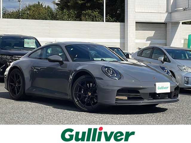 ポルシェ ポルシェ ９１１ カレラ 東京都 2024(令6)年 0.6万km グレー 車体色　M7J　スレートグレーネオ/ワンオーナー/スポーツクロノ/新車時保証書　/取扱説明書/ブレーキアシスト/レーンキープアシスト/レーンチェンジアシスト/アダプティブクルーズコントロール/純正ナビ/BT/USB/AppleCarplay/360度カメラ　ETC【2.0】/ドライブレコーダー【３６０度＋前後】/レザーシート/シートヒーター/フロント背もたれパワーシート/スポーツエキゾーストシステム/アクティブサスペンション/スマートキー×２/LEDヘッドライト/オートライト/パドルシフト付皮巻きハンドル/Carrera　S　20インチアルミ【フロント】/Carrera　S　21インチアルミ【リヤ】