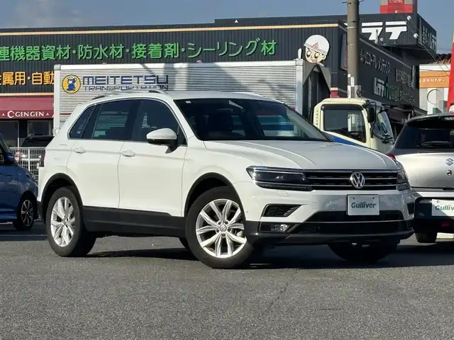 フォルクスワーゲン ティグアン TSI ハイライン 愛知県 2019(平31)年 1.5万km ピュアホワイト /正規ディーラー車/禁煙/黒革シート//純正ナビ/フルセグ/CD/DVD/SD/BT/USB/AUX//全方位カメラ/前後ドラレコ/ビルトインETC2.0//シートヒーター/メモリ付きパワーシート//革巻きステア/ステアスイッチ/パドルシフト//電動パ＾キングブレーキ//ACC/フロントアシスト/レーンキープアシスト/サイドアシスト//アテンションアラート/ダイナミックライトアシスト/パークアシスト//プロアクティブオキュパントプロテクション/パークアシスト//純正LEDオートライト/純正フォグ//純正ゴムマット/純正18インチAW/ルーフレール//パワーバックドア/照明付きバニティミラー//新車時保証書//取扱説明書//スペアスマートキー