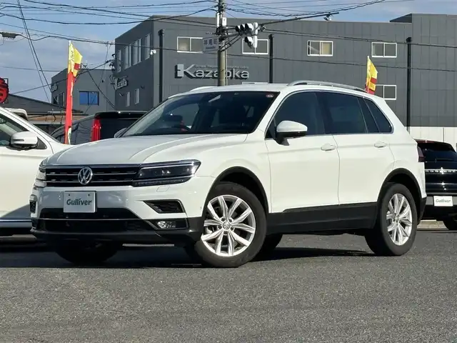 フォルクスワーゲン ティグアン TSI ハイライン 愛知県 2019(平31)年 1.5万km ピュアホワイト /正規ディーラー車/禁煙/黒革シート//純正ナビ/フルセグ/CD/DVD/SD/BT/USB/AUX//全方位カメラ/前後ドラレコ/ビルトインETC2.0//シートヒーター/メモリ付きパワーシート//革巻きステア/ステアスイッチ/パドルシフト//電動パ＾キングブレーキ//ACC/フロントアシスト/レーンキープアシスト/サイドアシスト//アテンションアラート/ダイナミックライトアシスト/パークアシスト//プロアクティブオキュパントプロテクション/パークアシスト//純正LEDオートライト/純正フォグ//純正ゴムマット/純正18インチAW/ルーフレール//パワーバックドア/照明付きバニティミラー//新車時保証書//取扱説明書//スペアスマートキー