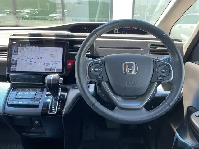 ホンダ ステップワゴン スパーダ ホンダセンシング 香川県 2019(平31)年 0.9万km プレミアムスパークルブラックパール 登録時走行距離：8922km/メーカー純正10型ナビ/　CD DVD BT フルセグTV/バックカメラ/純正11.6型フリップダウンモニター/両側パワースライドドア/衝突被害軽減装置/レーンキープアシスト/レーダークルーズコントロール/横滑り防止装置/アイドリングストップ/LEDヘッドライト/オートライト/フォグランプ/ロールサンシェード/革巻きステアリング/ステアリングスイッチ/パドルシフト/プッシュスタート/スマートキー/スペアキー