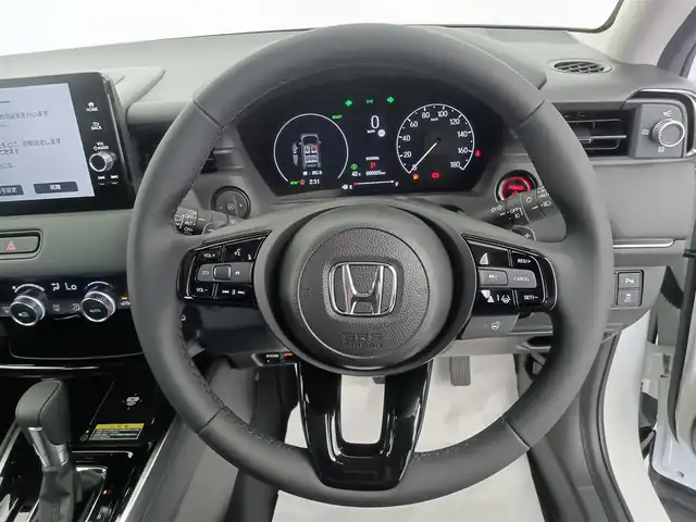 ホンダ ヴェゼル ハイブリッド e:HEV Z 愛知県 2025(令7)年 0.1千km プラチナホワイトパール ホンダセンシング/衝突被害軽減システム/クルーズコントロール/横滑り防止装置/コーナーセンサー/レーンキープアシスト/ブラインドスポットモニター/オートライト/オートマチックハイビーム/ワイヤレス充電器/純正9インチナビ/Apple CarPlay/Android Auto/Bluetooth/バックカメラ　/フルセグTV/LEDヘッドライト/LEDフォグランプ/電動リアゲート/シートヒーター/ステアリングヒーター/フルフラットシート/チップアップシート/ETC2.0/純正AW/スマートキー/スペアキー