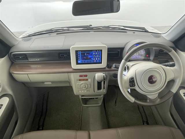 スズキ ラパン ＬＣ X 群馬県 2023(令5)年 1.3万km ソフトベージュメタリック 衝突被害軽減ブレーキ　社外７インチディスプレイオーディオ　バックカメラ　ＬＥＤライト　ハーフレザーシート　シートヒーター　純正１４インチＡＷ　ステアリングリモコン　スマートキー　プッシュスタート　禁煙