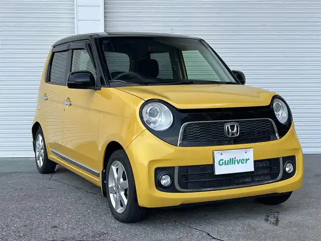 ホンダ Ｎ ＯＮＥ プレミアム Lパッケージ 高知県 2013(平25)年 9.6万km プレミアムイエローパールⅡ スマートキー/Bluetooth接続/プッシュスタート/バックカメラ/AM/FM/純正フロアマット/純正14インチアルミホイール/横滑り防止装置/盗難防止装置/オートライト/運転席＋助手席＋サイドエアバッグ/カーテンエアバッグ/ウッドパネル/本革巻きステアリング/AAC