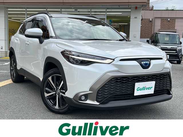 トヨタ カローラ クロス ハイブリッド Z 大阪府 2023(令5)年 1万km プラチナホワイトパールマイカ 純正ディスプレイオーディオ【AppleCarPay】/全周囲カメラ/運転席パワーシート/前席シートヒーター/レーダークルーズコントロール/プリクラッシュセーフティ/レーントレーシングアシスト/リアクロストラフィックアラート/電動リアゲート/ブラインドスポットモニター/電動パーキングブレーキ/ブレーキホールド/ETC