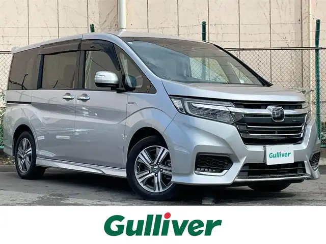 ホンダ ステップワゴン スパーダ eHEV G EXホンダS 東京都 2019(令1)年 7.6万km スーパープラチナメタリック Gathers純正ナビ/TV/CD/DVD/バックカメラ/衝突被害軽減ブレーキ/路外逸脱抑制/追従クルーズ/シートヒーター/両側パワースライドドア/ETC/ドライブレコーダー/スマートキー/純正アルミホイール