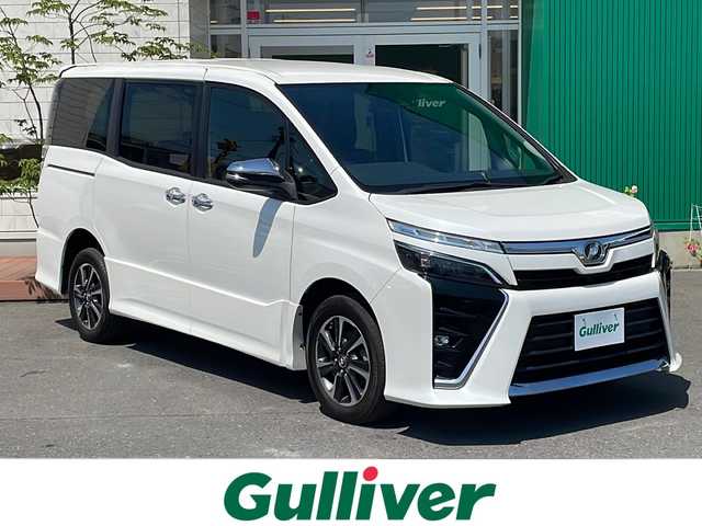 トヨタ ヴォクシー ZS 煌 青森県 2018(平30)年 5.5万km ホワイトパールクリスタルシャイン 4WD/寒冷地仕様/純正10インチナビ・フルセグTV/CD・DVD・Bluetooth/バックカメラ/両側パワースライドドア/セーフティセンス/プリクラッシュセーフティ/レーンディパーチャーアラート/オートマチックハイビーム/クルーズコントロール/純正エンジンスターター/前方ドライブレコーダー/ワイパーデアイサー/ビルトインETC/LEDヘッドライト/LEDフォグランプ/純正16インチアルミホイール
