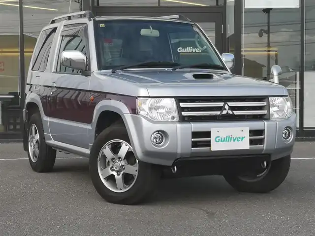 三菱 パジェロ ミニ エクシード 茨城県 2010(平22)年 5万km クールシルバーM/ラズベリーレッドP 純正チューナー/【ラジオ・CD・USB・AUX】/ルーフレール/ETC/４WD/ハロゲンライト/Fフォグ/ヘッドライトレベライザー/電格ミラー/純正フロアマット/純正アルミホイール/ドアバイザー/背面タイヤ