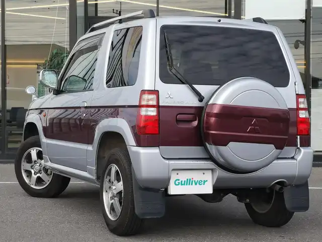 三菱 パジェロ ミニ エクシード 茨城県 2010(平22)年 5万km クールシルバーM/ラズベリーレッドP 純正チューナー/【ラジオ・CD・USB・AUX】/ルーフレール/ETC/４WD/ハロゲンライト/Fフォグ/ヘッドライトレベライザー/電格ミラー/純正フロアマット/純正アルミホイール/ドアバイザー/背面タイヤ