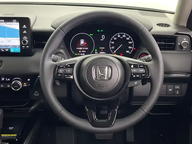 ホンダ ヴェゼル ハイブリッド e:HEV Z 鹿児島県 2025(令7)年 0.1千km パール 登録済未使用車/HondaSENSING/・衝突軽減ブレーキ/・誤発信抑制機能/・車線維持支援システム/・先行車発進お知らせ機能/・路外逸脱抑制機能/・トラフィックジャムアシスト/・渋滞追従機能付きアダプティブクルーズコントロール/・ブラインドスポットインフォメーション/純正ディスプレイオーディオ/(BT/Applecarplay/Androidauto/AM/FM/フルセグTV)/パドルシフト/純正ビルトインETC2.0/チップアップシート/ハーフレザーシート/前席シートヒーター/パワーバックドア/純正18インチアルミホイール/前後コーナーセンサー/オートマチックハイビーム/純正LEDヘッドライト
