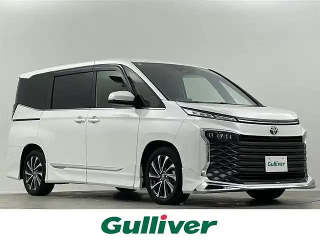 トヨタ ヴォクシー S－Z 埼玉県 2024(令6)年 1.4万km ホワイトパールクリスタルシャイン 禁煙車　快適利便ＰＫＧ　モデリスタエアロ　３眼ヘッドライト　純正１０．５型ナビ　ＣＤ　ＤＶＤ　ＢＴ　ＨＤＭＩ　ＥＴＣ２．０　アダプティブハイビーム　シートヒーター　バックカメラ　電動リアゲート