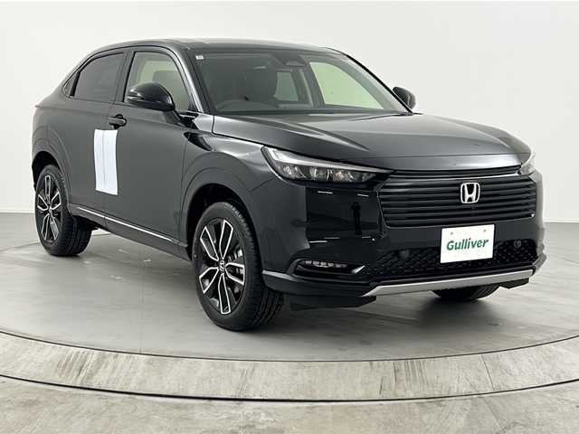 ホンダ ヴェゼル ハイブリッド e:HEV Z 熊本県 2025(令7)年 0.1千km クリスタルブラックパール ・純正９インチメモリナビ/・BT/USB/フルセグTV/・バックカメラ/・ホンダセンシング/・衝突軽減ブレーキ/・路外逸脱抑制機能/・クリアランスソナー/・横滑り防止装置/・ブラインドスポットモニター/・アダプティブクルーズコントロール/・ダウンヒルアシストコントロール/・前後コーナーセンサー/・パドルシフト/・パワーバックドア/・前席シートヒーター/・ステアリングヒーター/・ハーフレザーシート/・置くだけ充電/・オートマチックハイビーム/・LEDヘッドライト/・オートライト/・フォグランプ/・ETC2.0/・純正１８インチアルミホイール/・スマートキー/・スペアキー/・W＋サイドエアバッグ/・カーテンエアバッグ