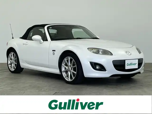 マツダ ロードスター 20周年記念車 大分県 2010(平22)年 7.5万km クリスタルホワイトパールマイカ 社外ナビ/（ワンセグ/AM/FM/Bluetooth）/6速マニュアル/レザーシート/シートヒーター/ETC/ステアリングスイッチ/純正アルミホイール/オートエアコン/オートウインドウ/保証書・取扱説明書/スペアキー