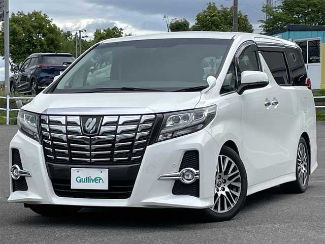 トヨタ アルファード SA Cパッケージ 道央・札幌 2016(平28)年 5.7万km ホワイトパールクリスタルシャイン ４WD/純正ディーラーOPナビ/CD/DVD/BT/フルセグ/純正フリップダウンモニター/プリクラッシュセーフティ/横滑り防止装置/レーダークルーズコントロール/クリアランスソナー/バックカメラ/ビルトインETC/ECOMODE/nanoe/自動防眩ミラー/両側パワースライドドア/パワーバックドア/前席/２列目パワーシート/D席メモリーシート/N席/２列目オットマン/ハーフレザーシート/革巻きウッドコンビステアリング/ステアリングリモコン/ハンドルヒーター/電動格納ミラー/ウィンカーミラー/純正フロアマット/ドアバイザー/スペアキー/社外エンジンスターター/社外車高調整サスペンションキッド
