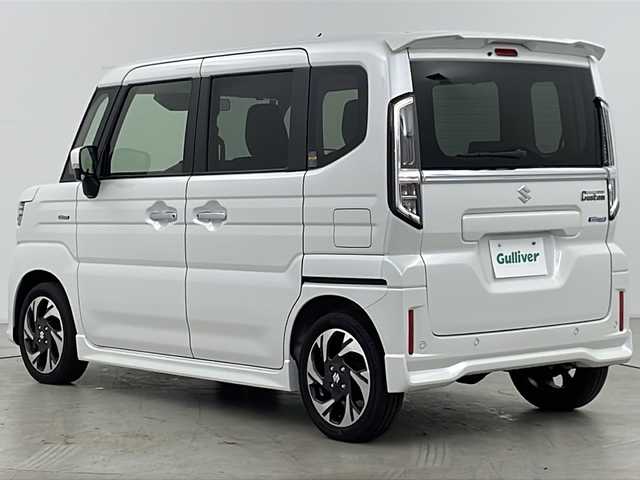 スズキ スペーシア カスタム HYBRID XS 道央・札幌 2024(令6)年 0.7万km ピュアホワイトP ・4WD/・純正ナビ&CD&DVD&SD&BT&TV/・両側パワースライドドア/・スズキセーフティサポート/・レーダークルーズコントロール/・コーナーセンサー/・ヘッドアップディスプレイ/・アイドリングストップ/・横滑り防止装置/・前席シートヒーター/・ステアリングヒーター/・LEDヘッドライト/・オートライト/・スマートキー