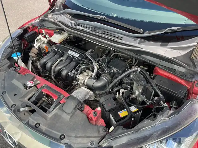 ホンダ ヴェゼル ハイブリッド Z ホンダセンシング 神奈川県 2017(平29)年 5.4万km プレミアムクリスタルレッドM 純正メモリナビ（VXM-175VFi）/Bluetooth/CD/DVD/フルセグ/USB/追従式クルーズコントロール/前席シートヒーター/パドルシフト/パーキングセンサー/ルーフレール/LEDヘッドライト/LEDフォグランプ/ブレーキホールド/シートポジションメモリー/プッシュスタート/スマートキー/純正アルミホイール/純正フロアマット/ETC/電動格納ミラー/ドアバイザー/横滑り防止装置/レーンキープアシスト/衝突被害軽減システム