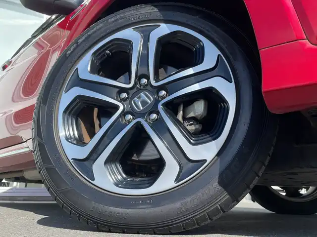 ホンダ ヴェゼル ハイブリッド Z ホンダセンシング 神奈川県 2017(平29)年 5.4万km プレミアムクリスタルレッドM 純正メモリナビ（VXM-175VFi）/Bluetooth/CD/DVD/フルセグ/USB/追従式クルーズコントロール/前席シートヒーター/パドルシフト/パーキングセンサー/ルーフレール/LEDヘッドライト/LEDフォグランプ/ブレーキホールド/シートポジションメモリー/プッシュスタート/スマートキー/純正アルミホイール/純正フロアマット/ETC/電動格納ミラー/ドアバイザー/横滑り防止装置/レーンキープアシスト/衝突被害軽減システム