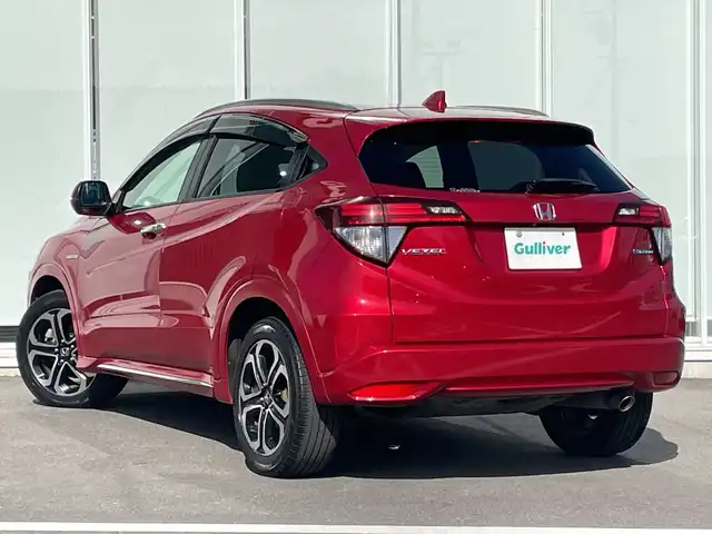 ホンダ ヴェゼル ハイブリッド Z ホンダセンシング 神奈川県 2017(平29)年 5.4万km プレミアムクリスタルレッドM 純正メモリナビ（VXM-175VFi）/Bluetooth/CD/DVD/フルセグ/USB/追従式クルーズコントロール/前席シートヒーター/パドルシフト/パーキングセンサー/ルーフレール/LEDヘッドライト/LEDフォグランプ/ブレーキホールド/シートポジションメモリー/プッシュスタート/スマートキー/純正アルミホイール/純正フロアマット/ETC/電動格納ミラー/ドアバイザー/横滑り防止装置/レーンキープアシスト/衝突被害軽減システム
