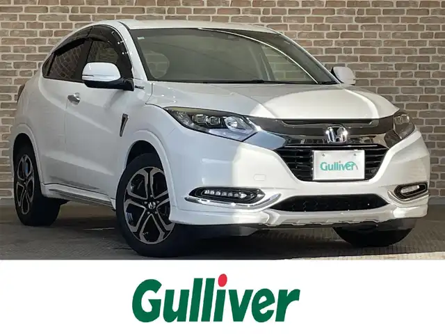 ホンダ ヴェゼル ハイブリッド 岩手県 2017(平29)年 11.6万km ホワイトオーキッドパール ワンオーナー/４WD/パドルシフト/レーンアシスト/衝突被害軽減ブレーキ/横滑り防止装置/バックカメラ/リアクティブフォースペダル/クルーズコントロール/フロントワイパーデアイサー/チップアップリアシート/オールオートパワーウィンドウ/シートヒーター/ETC/ドライブレコーダー/ハーフレザーシート/純正フロアマット/純正１７インチアルミホイール/純正LEDヘッドライト