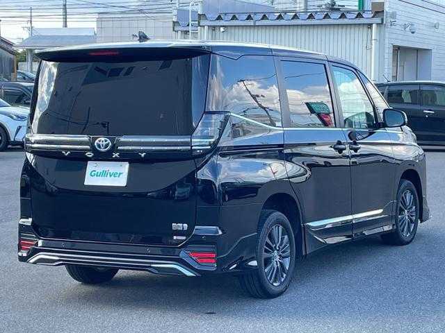 トヨタ ヴォクシー ハイブリッド S－Z 山形県 2025(令7)年 0.9万km アティチュードブラックマイカ 4WD/トヨタセーフティセンス/快適パッケージ/MODELLISTAフルエアロ/純正メモリナビ/　　【CD　DVD　BT　フルセグ　USB】/バックカメラ/両側パワースライドドア/パワーバックドア/レーダークルーズコントロール/LEDオートライト/ハーフレザーシート/シートヒーター/純正16インチアルミホイール/ステアリングスイッチ/ドライブレコーダー/スマートキー×2/ETC2.0/ワンオーナー