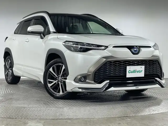 トヨタ カローラ クロス ハイブリッド Z 神奈川県 2022(令4)年 2.3万km プラチナホワイトパールマイカ パノラマガラスルーフ　/モデリスタエアロ　/純正9インチディスプレイオーディオ　/Miracast　Bluetooth　USB　フルセグTV　/バックカメラ　/トヨタセーフティセンス　/プリクラッシュセーフティ　/レーントレーシングアシスト　/クリアランスソナー　/レーダークルーズコントロール　/オートマチックハイビーム　/ロードサインアシスト　/ハーフレザーシート　/運転席パワーシート　/前席シートヒーター　/ドアバイザー　/電動パーキングブレーキ　/オートブレーキホールド