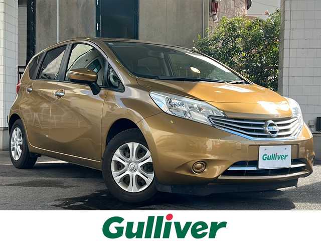 日産 ノート メダリスト X 京都府 2015(平27)年 6.6万km ビートニックゴールド 純正7インチナビ/フルセグTV/Bluetooth Audio/衝突軽減装置/レーンキープアシスト/禁煙車/ハーフレザーシート/ウインカーミラー/アイドリングストップ/ETC/オートライト/純正フロアマット/純正ホイールカバー/リアワイパー/取扱説明書/スマートキースペア