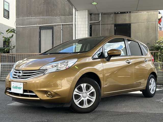 日産 ノート メダリスト X 京都府 2015(平27)年 6.6万km ビートニックゴールド 純正7インチナビ/フルセグTV/Bluetooth Audio/衝突軽減装置/レーンキープアシスト/禁煙車/ハーフレザーシート/ウインカーミラー/アイドリングストップ/ETC/オートライト/純正フロアマット/純正ホイールカバー/リアワイパー/取扱説明書/スマートキースペア