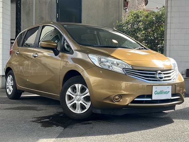 日産 ノート メダリスト X 京都府 2015(平27)年 6.6万km ビートニックゴールド 純正7インチナビ/フルセグTV/Bluetooth Audio/衝突軽減装置/レーンキープアシスト/禁煙車/ハーフレザーシート/ウインカーミラー/アイドリングストップ/ETC/オートライト/純正フロアマット/純正ホイールカバー/リアワイパー/取扱説明書/スマートキースペア