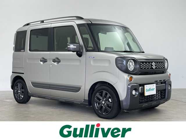 スズキ スペーシア ギア HYBRID XZターボ 鹿児島県 2023(令5)年 0.8万km スチールシルバーM ワンオーナー/禁煙車/スズキセーフティサポート/スズキコネクトナビ/全方位カメラ/ヘッドアップディスプレイ/前席シートヒーター/ETC/前後ドライブレコーダー/両側パワースライドドア/衝突軽減ブレーキ/レーンキープアシスト/レーダークルーズコントロール/パドルシフト/アイドリングストップ/バックカメラ/ルーフレール/後方コーナーセンサー/純正フロアマット/純正14インチアルミホイール/純正LEDヘッドライト