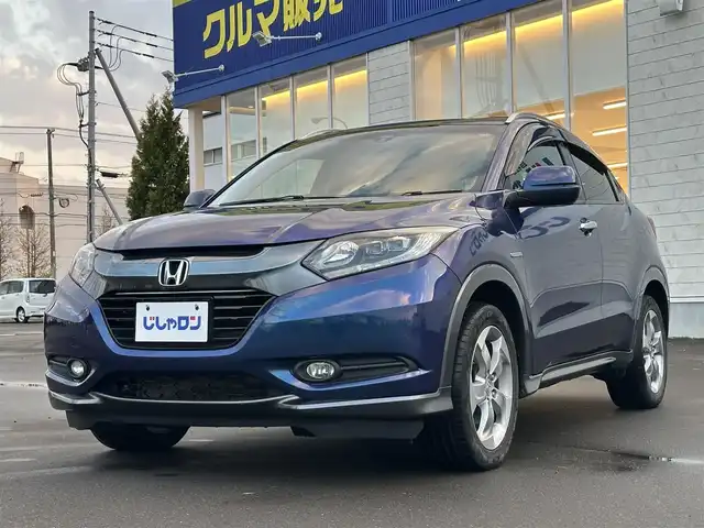 ホンダ ヴェゼル ハイブリッド X Lパッケージ 道北・旭川 2014(平26)年 12.5万km モルフォブルーP (株)IDOMが運営する【じしゃロン旭川店】の自社ローン専用車両になります。こちらは現金またはオートローンご利用時の価格です。自社ローンご希望の方は別途その旨お申付け下さい/　/・純正ナビ(CD/DVD/BT/SD/フルセグ)/・バックカメラ/・ETC/・レーダーブレーキ/・クルーズコントロール/・パドルシフト/・ステアリングリモコン/・両席シートヒーター/・電動格納ウィンカーミラー/・プッシュスタート/・スマートキー2個/・フォグランプ/・取扱説明書