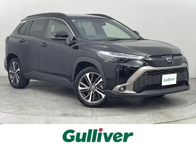 トヨタ カローラ クロス ハイブリッド Z 道央・札幌 2024(令6)年 1.2万km アティチュードブラックマイカ ・４WD/・サンルーフ/・10.5型ディスプレイオーディオ（コネクティッドナビ対応）Plus/　Miracast/BT/USB/フルセグTV/・ステアリングスイッチ/・パノラミックビューモニター/・ビルトインETC2.0/・ドライブレコーダー前後/・トヨタセーフティセンス/・プリクラッシュセーフティ/・レーンキープアシスト/・ブラインドスポットモニター/・クリアランスソナー/・アダプティブクルーズコントロール/・オートマチックハイビーム/・パーキングアシスト/・アイドリングストップ/・横滑り防止装置/・ABS/・LEDヘッドライト/・オートライト/・ハーフレザーシート/・D+N席シートヒーター/・D席パワーシート/・革巻きステアリング/・パワーバックドア/・純正１８インチAW/・純正フロアマット/・プッシュスタート/・スマートキー/・スペアキー