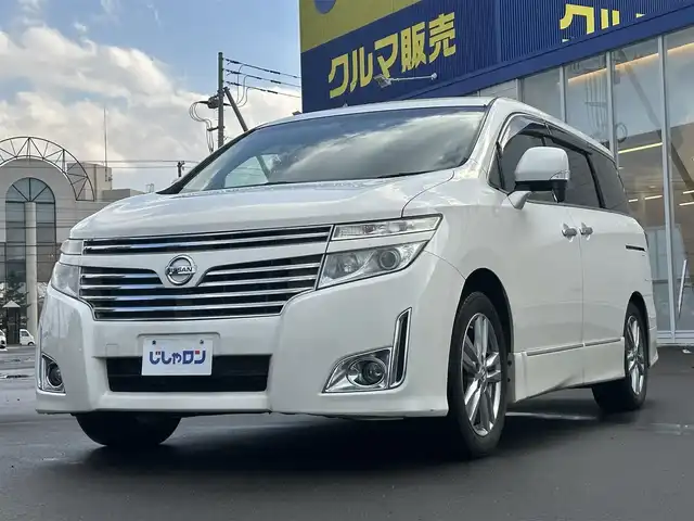 日産 エルグランド 250ハイウェイスター 道北・旭川 2013(平25)年 12.8万km ブリリアントホワイトパール (株)IDOMが運営する【じしゃロン旭川店】の自社ローン専用車両になります。こちらは現金またはオートローンご利用時の価格です。自社ローンご希望の方は別途その旨お申付け下さい/　/・純正ナビ(CD/DVD/BT/SD/フルセグ)/・バックカメラ/・ETC/・ドライブレコーダー/・両側パワースライドドア/・フリップダウンモニター/・電動格納ウィンカーミラー/・プッシュスタート/・スマートキー2個/・フォグランプ/・取扱説明書