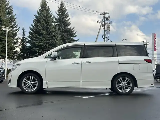 日産 エルグランド 250ハイウェイスター 道北・旭川 2013(平25)年 12.8万km ブリリアントホワイトパール (株)IDOMが運営する【じしゃロン旭川店】の自社ローン専用車両になります。こちらは現金またはオートローンご利用時の価格です。自社ローンご希望の方は別途その旨お申付け下さい/　/・純正ナビ(CD/DVD/BT/SD/フルセグ)/・バックカメラ/・ETC/・ドライブレコーダー/・両側パワースライドドア/・フリップダウンモニター/・電動格納ウィンカーミラー/・プッシュスタート/・スマートキー2個/・フォグランプ/・取扱説明書