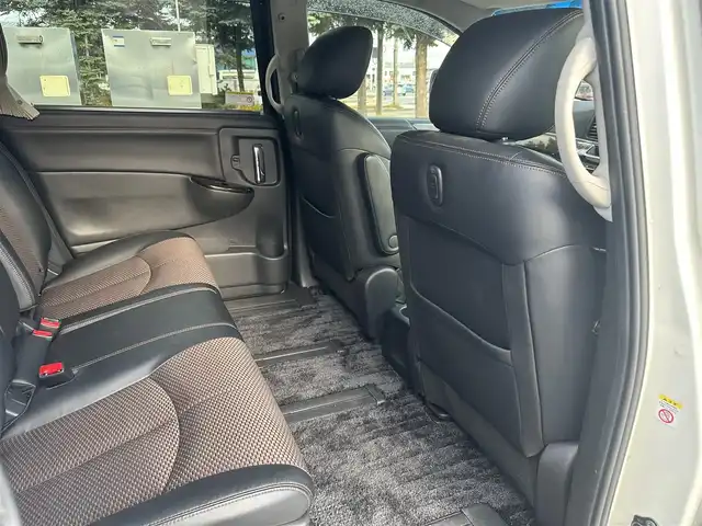 日産 エルグランド 250ハイウェイスター 道北・旭川 2013(平25)年 12.8万km ブリリアントホワイトパール (株)IDOMが運営する【じしゃロン旭川店】の自社ローン専用車両になります。こちらは現金またはオートローンご利用時の価格です。自社ローンご希望の方は別途その旨お申付け下さい/　/・純正ナビ(CD/DVD/BT/SD/フルセグ)/・バックカメラ/・ETC/・ドライブレコーダー/・両側パワースライドドア/・フリップダウンモニター/・電動格納ウィンカーミラー/・プッシュスタート/・スマートキー2個/・フォグランプ/・取扱説明書