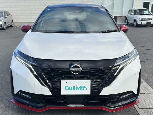 日産 オーラ ニスモ 香川県 2023(令5)年 4.7万km ピュアホワイトパール / スーパーブラック 2トーン 純正メーカーOP9インチワイドディスプレイ（フルセグTV/BT)/アラウンドビューモニター/ブラインドスポットモニター/デジタルインナーミラー/メーカーOPワイヤレス充電/車線逸脱防止支援/ルート減速支援/標識検知支援/ハンドル支援/速度標識表示/制限速度支援/後退時車両検知警報/ふらつき警報/トレースコントロール/パーソナルディスプレイ/プロパイロット/ドライブレコーダー/コーナーセンサー/ビルトインETC2.0/LEDヘッドライト/オートライト/スペアキー