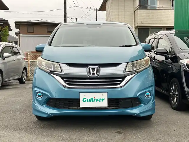 ホンダ フリード ハイブリット EX 静岡県 2016(平28)年 1.6万km ブルーホライゾンM エンジンスタートボタン/スマートキー/アイドリングストップ/パワーステアリング/パワーウィンドウ/寒冷地仕様/オートエアコン/クルーズコントロール/USB入力端子/ETC/バックカメラ/ナビ（CD.BT.フルセグ）/3列シート/ドライブレコーダー/ウォークスルー/純正フロアマット/純正アルミホイール/ハーフレザー/D席N席シートヒーター/両側パワースライドドア/ABS/横滑り防止装置/レーンキープアシスト/オートライト/W+サイドエアバック/衝突軽減システム/カーテンエアバック