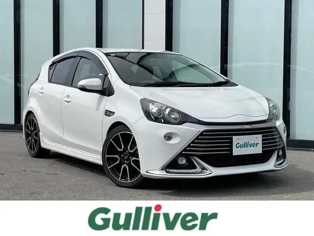 トヨタ アクア G G’s 大阪府 2015(平27)年 2.8万km ライムホワイトパールクリスタルシャイン 純正ナビ/   フルセグTV/CD/DVD/Bluetooth/バックモニター/横滑り防止装置/社外エアロ　/レーンキープアシスト/クルーズコントロール/ステアリングスイッチ/純正17インチアルミホイール/純正フロアマット/プッシュスタート/スマートキー/ハーフレザーシート/ＥＴＣ/ＬＥＤライト