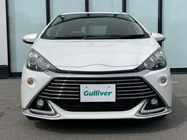 トヨタ アクア G G’s 大阪府 2015(平27)年 2.8万km ライムホワイトパールクリスタルシャイン 純正ナビ/   フルセグTV/CD/DVD/Bluetooth/バックモニター/横滑り防止装置/社外エアロ　/レーンキープアシスト/クルーズコントロール/ステアリングスイッチ/純正17インチアルミホイール/純正フロアマット/プッシュスタート/スマートキー/ハーフレザーシート/ＥＴＣ/ＬＥＤライト